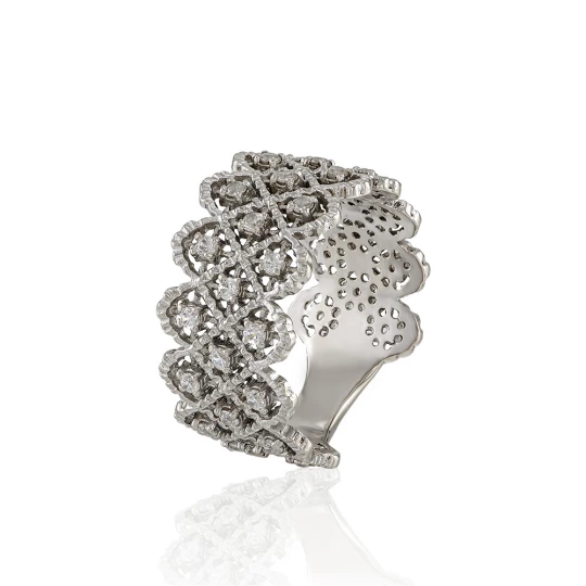 Wide ring of white gold with a scattering of stones.