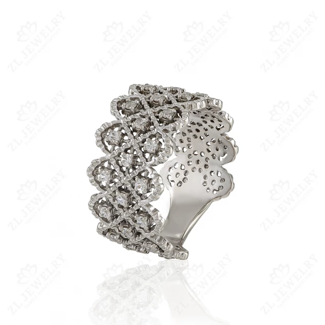 Wide ring of white gold with a scattering of stones.